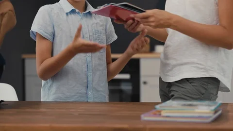 Joyful schoolboy prepares backpack for school. Back to School. 스톡 동영상 92498735