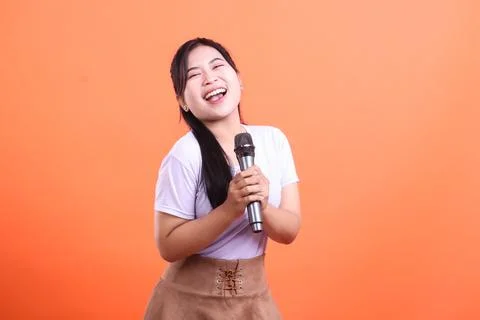 Joyful Singer with Microphone Stock Photos