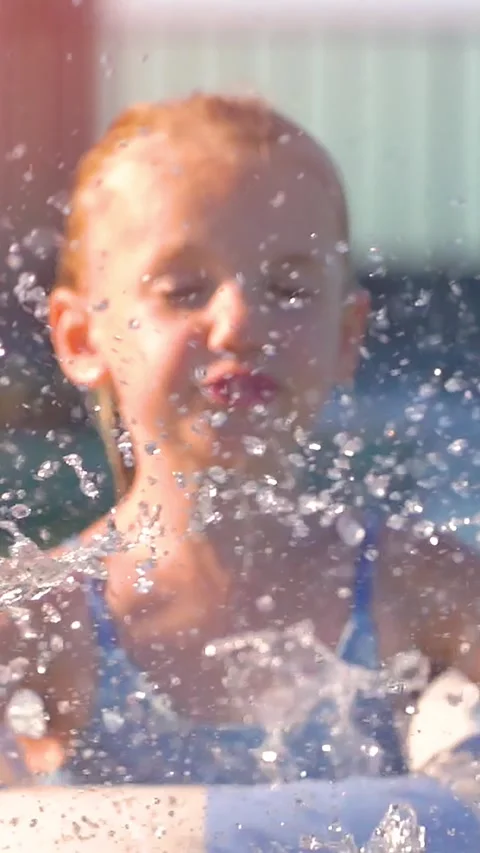 Joyful splashes in a summer pool Stock Footage 332932844