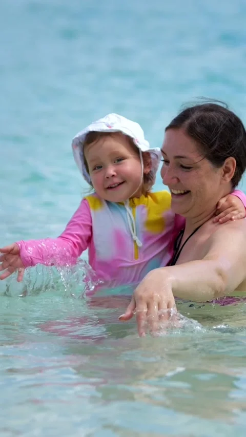 Joyful Summer Seaside Outing. Mother And Child Enjoying Sunny Beach Day. Happy 스톡 동영상 333441665