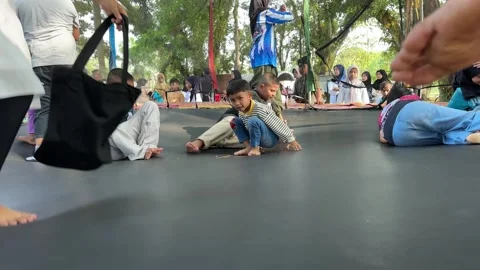 Joyful Thai Childrens on a trampoline Stock Footage 326329087