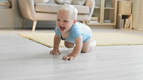 Joyful Toddler Crawling Stock Footage 142198412
