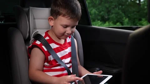 Joyful travel with kids, Interactive learning in car, Modern child passenger Stock Footage 312724697