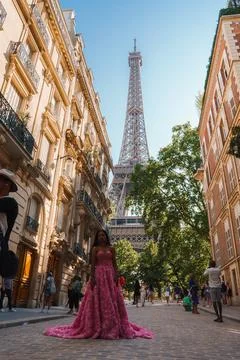 Joyful Woman Posing at Eiffel Tower Dusk Scene Stock Photos