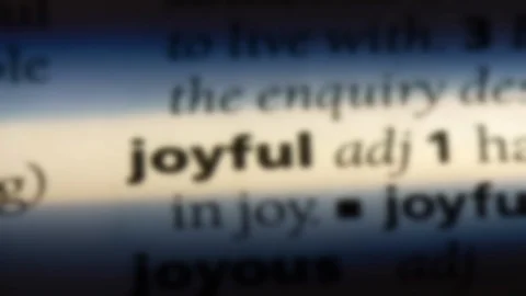 Joyful word in a dictionary. Stock Footage 99561798