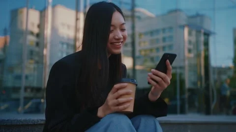Joyful young attractive multi-race business girl using mobile phone, smiling Stock Footage 156510067