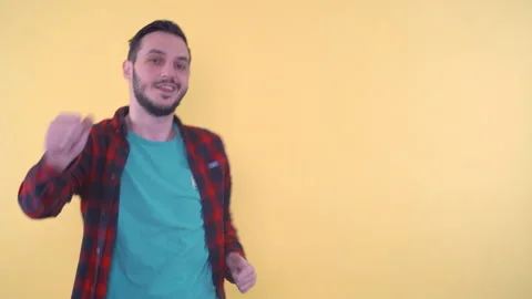 Joyful Young Man Dancing Moving Arms and Body in Studio Stock Footage 151824097