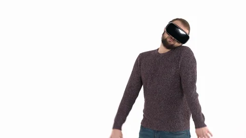 Joyful young man in virtual reality glasses having fun and imitating zombie Stock Footage 121195891