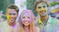 Joyful young people smiling to camera, clapping hands covered in color powder 4k or 4k+ Resolution