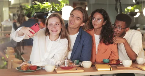 Joyfull colleagues posing for selfies while spending good time during lunch Stock-Footage 135571247