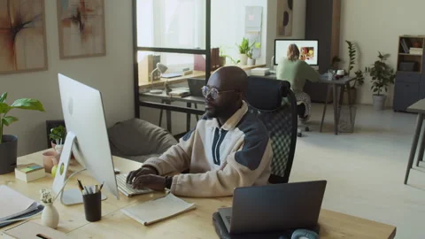 Joyous Black Male Programmer Cheering at Successful Test Stock Footage 293122533