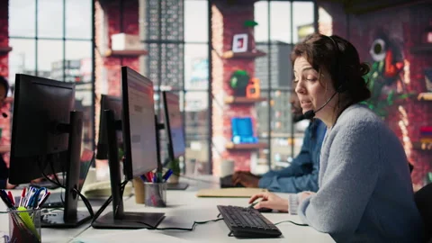 Joyous call center agent providing guidance to customers, solving concerns Stock Footage 305397787