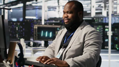 Joyous data center software developer delighted after solving all computer bugs Stock Footage 309630466