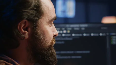 Joyous IT admin looking at PC screen, pleased after solving script errors Stock Footage 265337020