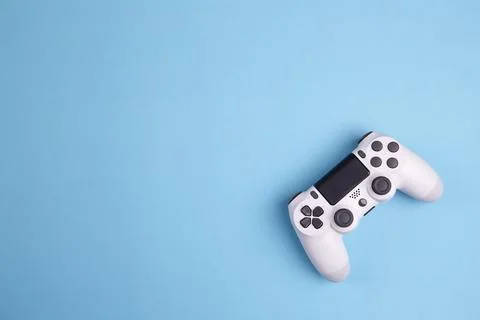 Joystick gaming controller isolated on blue background , Video game console.. Foto stock