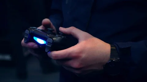 Joystick in the hands of a gamer Video stock 106604255