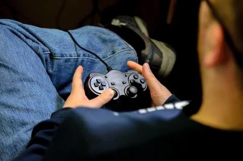 Joystick in their hands Stock Photos