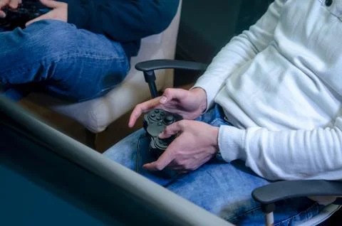 Joystick in their hands Stock Photos