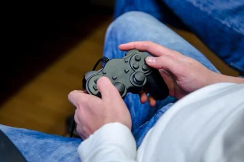 Joystick in their hands Stock Photos