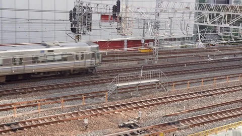 JR train running on outer Osaka Loop line is seen bound to Osaka Station Stock Footage 99522317
