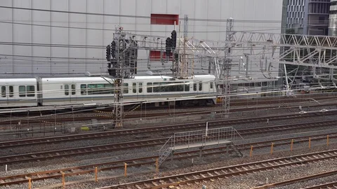 JR Train is seen at Osaka Loop bound for Tennoji Station Stock Footage 98991206