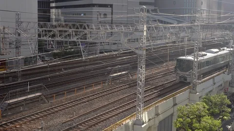 JR Train is seen at Osaka Loop bound for Tennoji Station Stock Footage 98991218