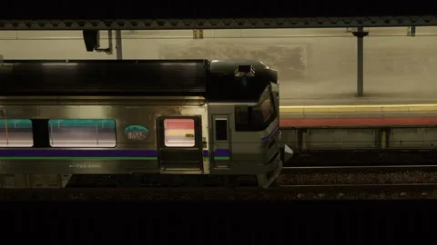 JR train stopped at station platform at night, Hakodate, Japan, 2026.09.10. Stock Footage 345429304