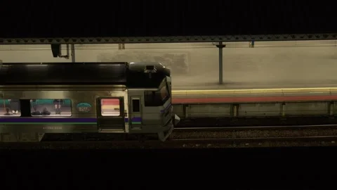 JR train stopped at station platform at night, Hakodate, Japan, 2026.09.10. Stock Footage 345429660