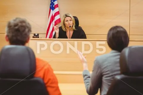 Judge and lawyer discussing the sentence for prisoner Stock Photos