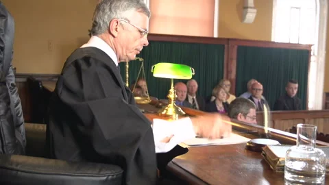 Judge calling order and hitting the gavel in Court with Jury behind. Courtroom. Stock Footage