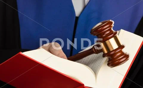 Judge with gavel and law book Stock Photos