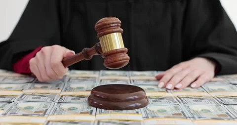 Judge gavel and a stack of hundred dollar bills Stock Footage 277028099