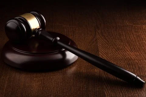 Judge hammer on the table Stock Photos