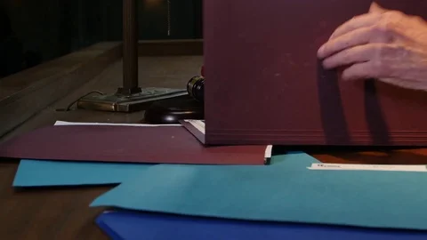 Judge hands closing folder and settling case in court room Stock Footage 73588920