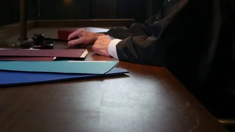 Judge hands making a ruling in court house law Stock Footage