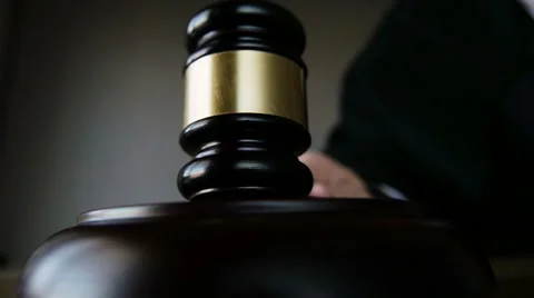 Judge striking gavel, slow motion CU Stock Footage