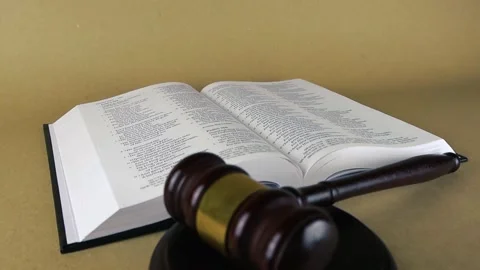 Judge's gavel resting on open holy bible Stock Footage 343370508
