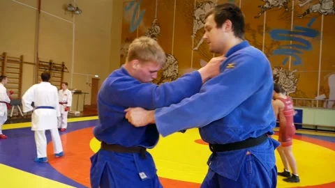 Judoists show captures and throws on each other Stock Footage 185437488