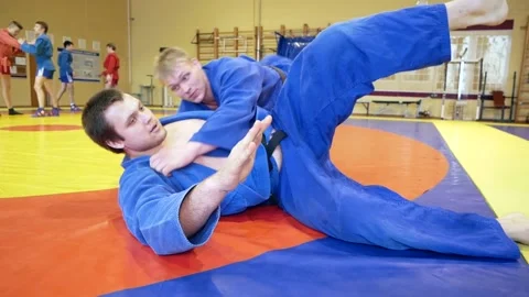 Judoists show captures and throws on each other. Stock Footage 185437641