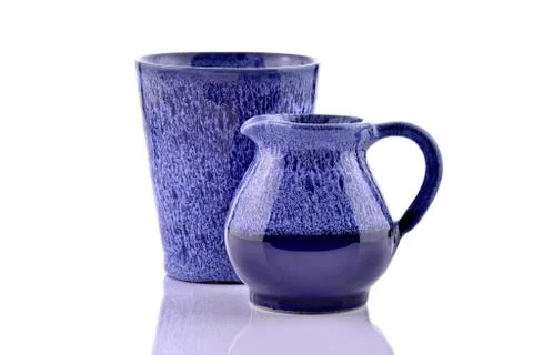 Jug with cup Stock Photos