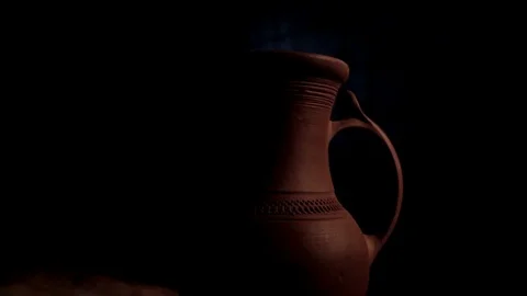 The jug is highlighted in a searchlight Stock Footage 71767063