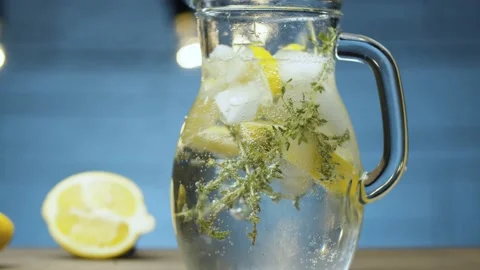 Jug with lemonade with thyme Stock Footage 142882755