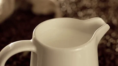 Jug with milk in slow motion Stock Footage 76100453