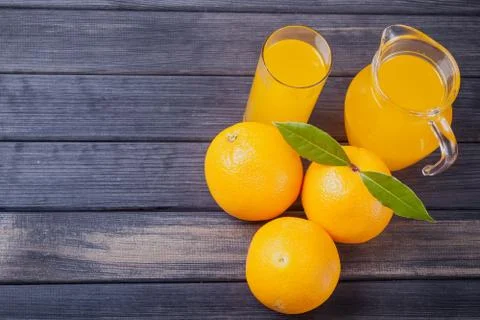 Jug of orange juice on the table. rustic top view still life Stock Photos