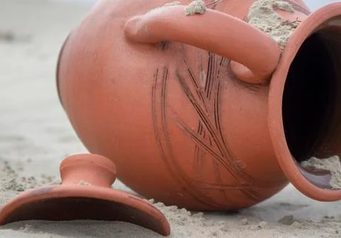 Jug in the sand. Stock Photos