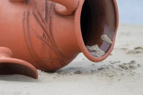 Jug in the sand. Stock Photos