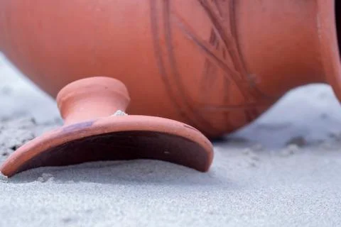 Jug in the sand. Stock Photos