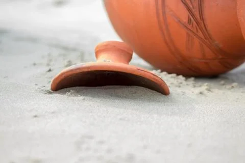 Jug in the sand. Stock Photos