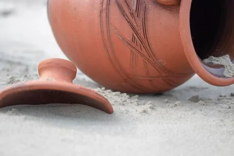 Jug in the sand. Stock Photos