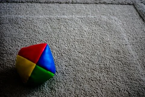 Juggle ball on grey carpet Stock Photos